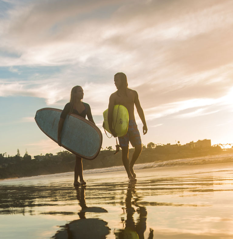 2 surfers walking along LaJolla Shores  | San Diego CA