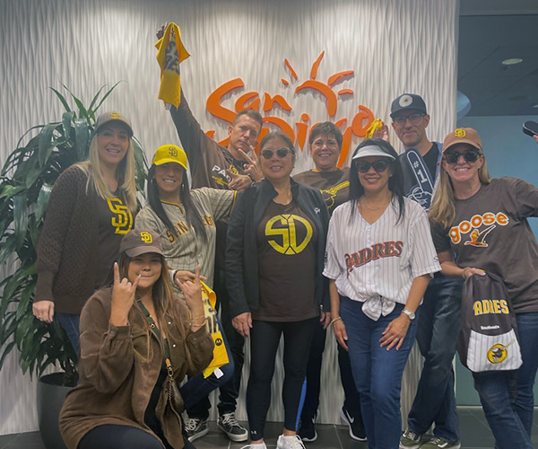 SDTA Team Members in Padres regalia at the office