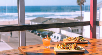 Tacos on a table overlooking the Pacific Ocean