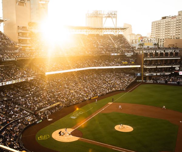The Padres playing at Petco Park as the sun sets over San Diego