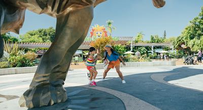 Mother and daughters excited to visit a the San Diego Zoo during the summer