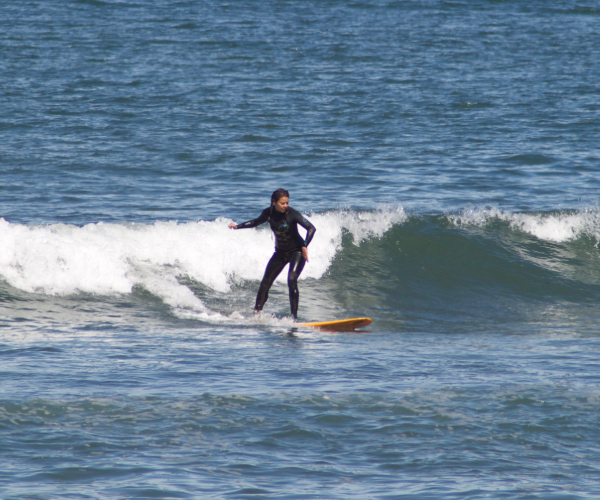 Woman surfing in San Diego in Ocean Beach