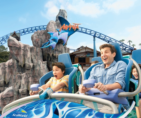 Father and son ridining the Manta roller coaster at SeaWorld San Diego