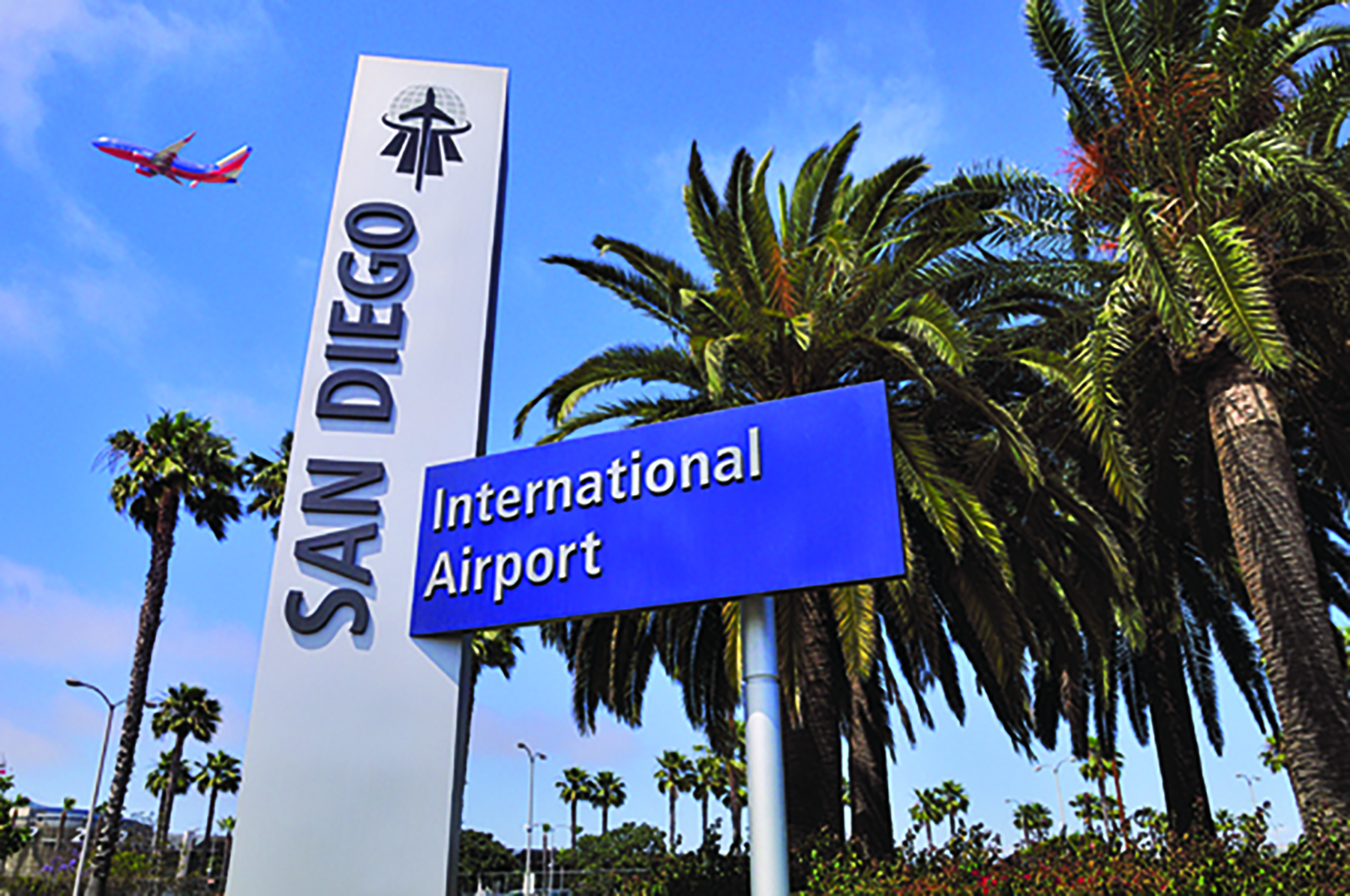 San Diego International Airport sign with plane