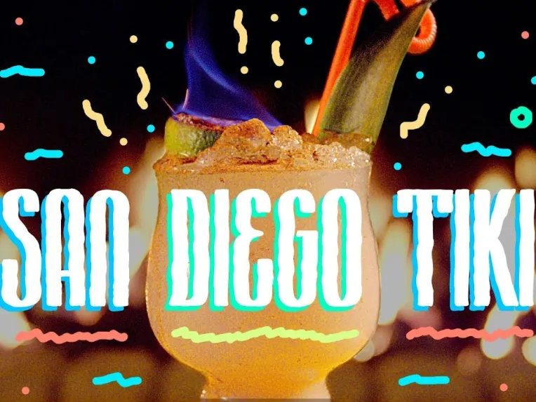A tropical cocktail with a slice of pineapple and a flaming garnish, surrounded by colorful squiggles. Text reads "San Diego Tiki.