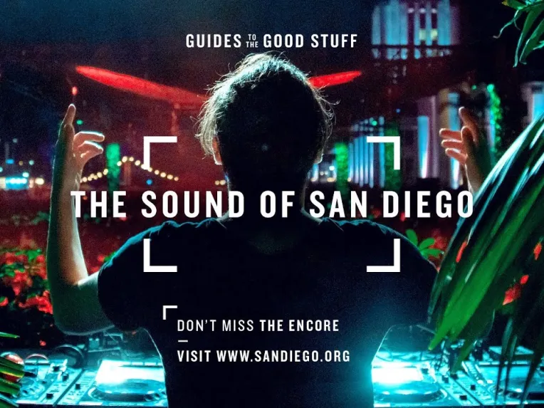 A DJ performs on stage with bright lights and plants in the foreground; text reads "The Sound of San Diego" and provides a website for more information.