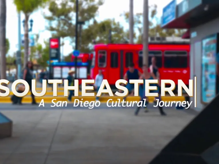 A red San Diego trolley at a station with people walking nearby; large text reads "SOUTHEASTERN: A San Diego Cultural Journey.