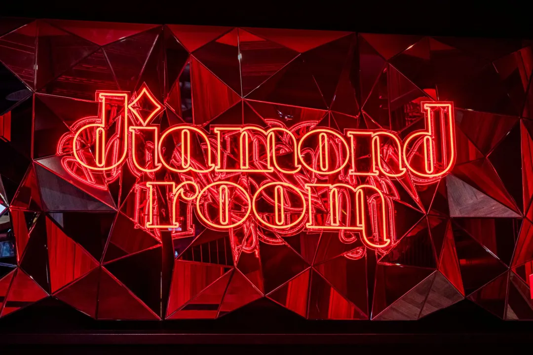 A view of a lighted sign reading "Diamond Room" at the entrance to a new nightclub at the San Diego Padres' Petco Park.
