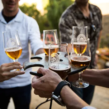 Group enjoying beer tasters at a local brewery in San Diego