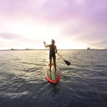 A woman on the paddle board in Mission Bay in San Diego