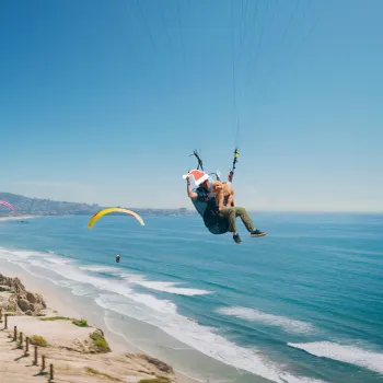 Hang gliders over Torrey Pines with some fun Holiday graphics added to the image.