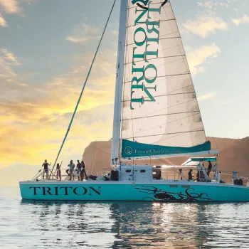 Group of people on a luxury charter sail boat in San Diego bay at sunset