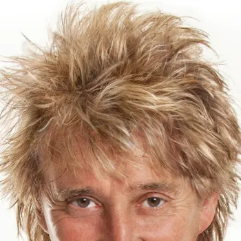 A close-up image showing the upper part of a person's face and head with tousled, spiky blonde hair against a plain white background.