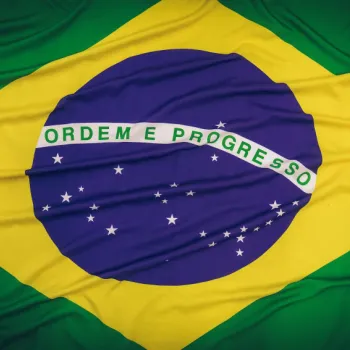 The flag of Brazil featuring a green field, yellow diamond, blue globe with stars, and a white banner with the motto “Ordem e Progresso.”.