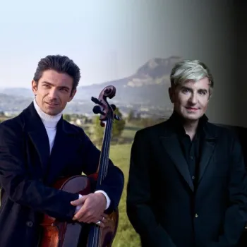 Two men stand side by side; one holds a cello outdoors with hills in the background, while the other stands indoors beside a piano in dim lighting.