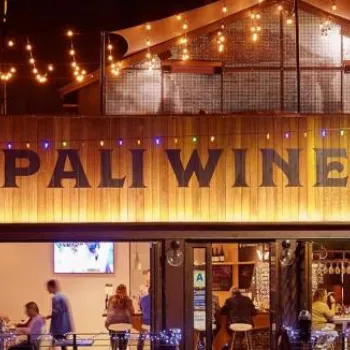 A restaurant with a sign on the front.