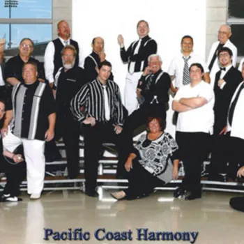 A group of men and one woman pose together on risers, wearing coordinated black and white outfits. The text "Pacific Coast Harmony" appears at the bottom.