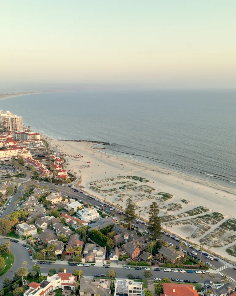 Aerial of Coronado Beach with the sand dunes that spell out Coronado
