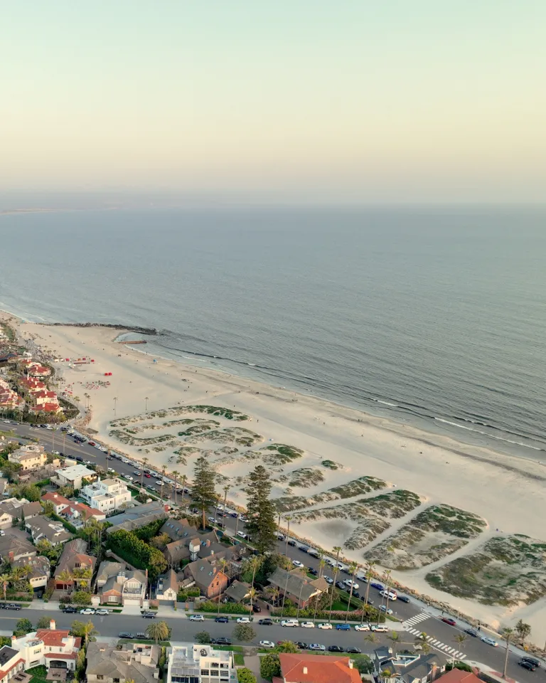 Aerial of Coronado Beach with the sand dunes that spell out Coronado