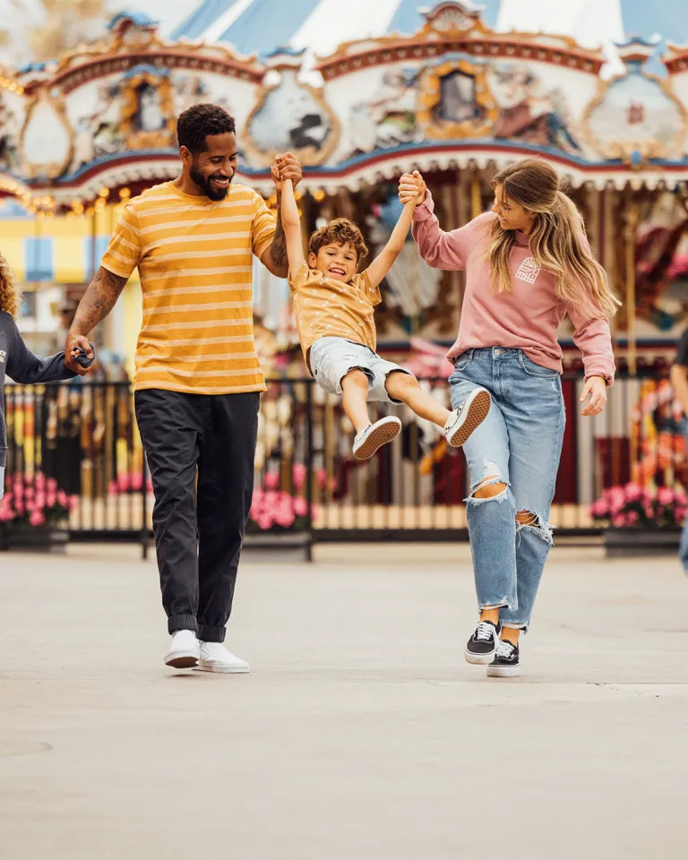 Family of four with two kids walking into Belmont Park