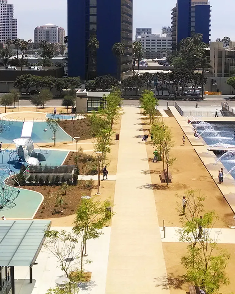 Aerial view of grass, playground and fountains at Waterfront Park in downtown San Diego