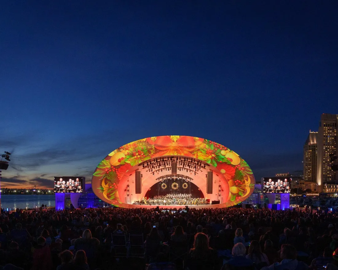 Crowds at the Rady Shell at Jacobs Park enjoying the Noel Noel concert during a night under the skies of San Diego