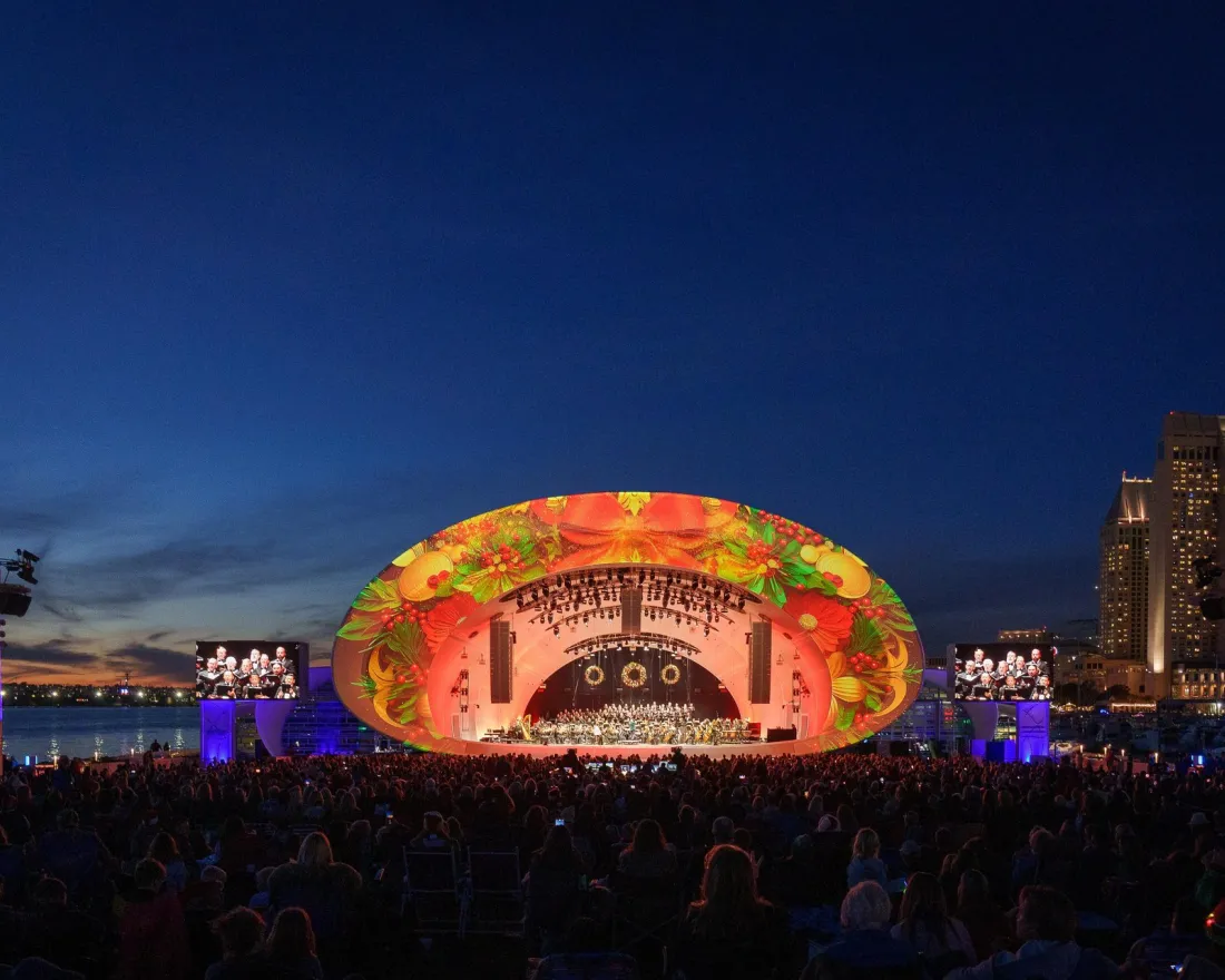Crowds at the Rady Shell at Jacobs Park enjoying the Noel Noel concert during a night under the skies of San Diego