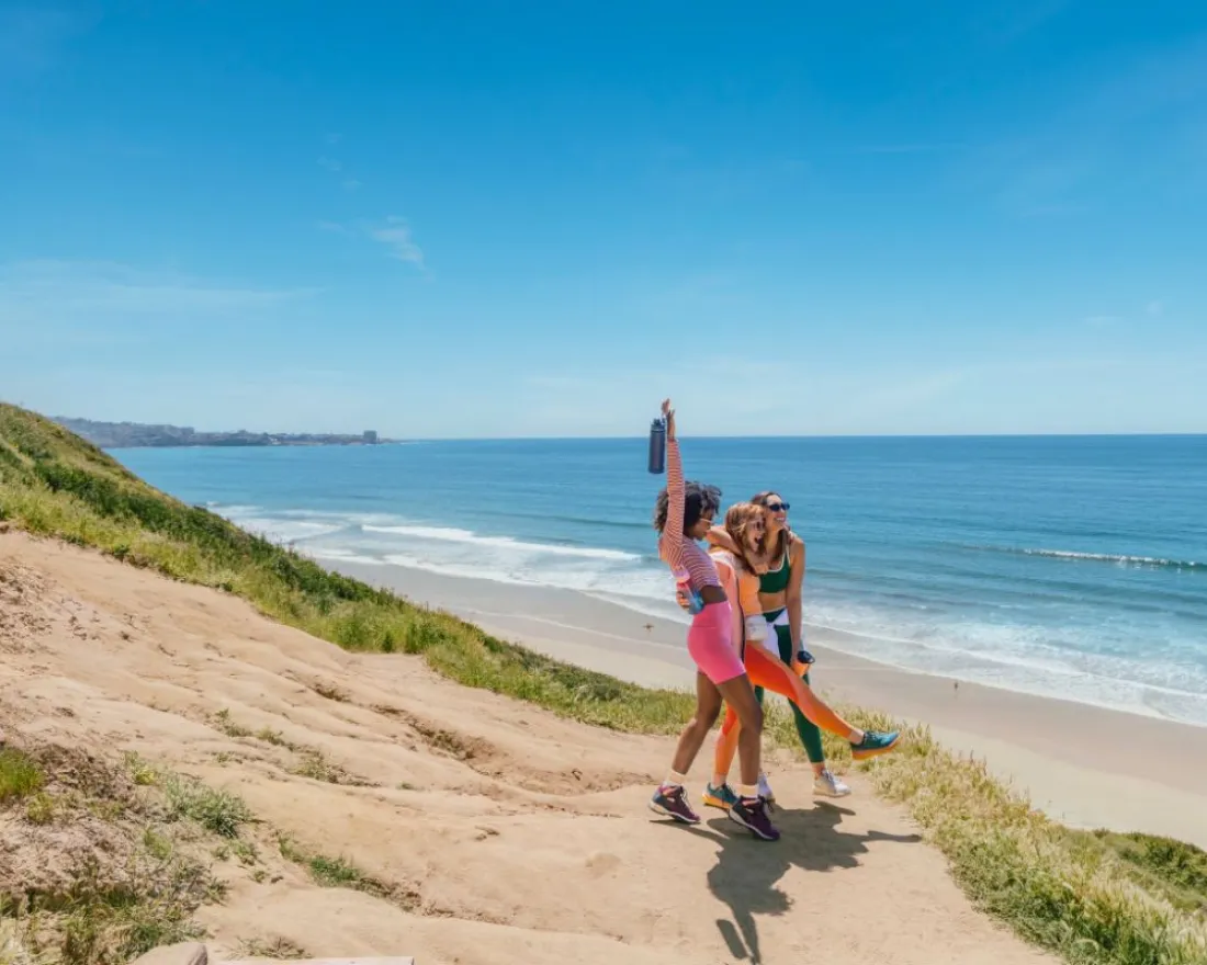 A group of women hiking in La Jolla Torrey Pines Nature Reserve in San Diego