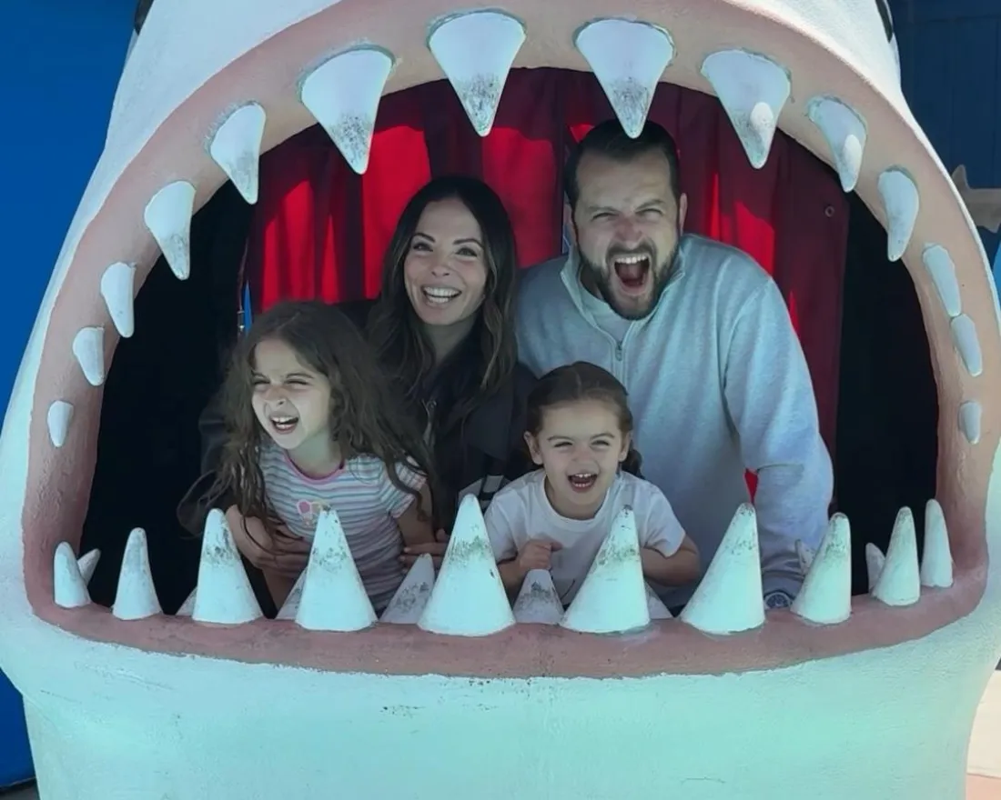 alexandra lourdes and her family at the birch aquarium inside one of the sharks all making scary silly faces