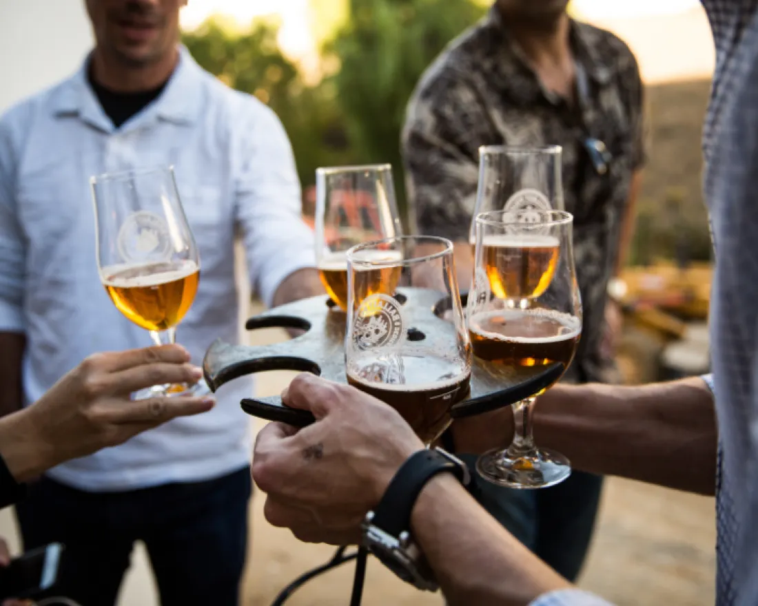 A group of people holding beer