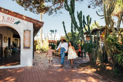 A mother and her children walking through Old Town