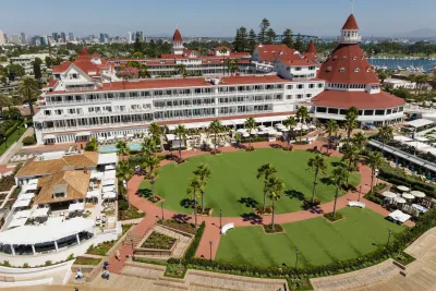 Aerial of the Hotel del Coronado and it's famous red roof with the San Diego skyline in the background