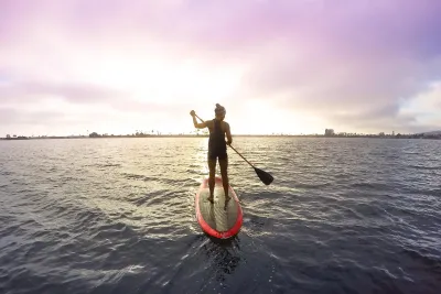 A woman on the paddle board in Mission Bay in San Diego