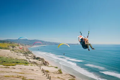 Hang gliders over Torrey Pines with some fun Holiday graphics added to the image.