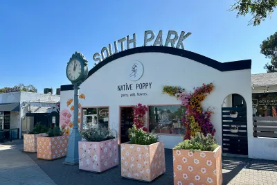 South Park neighborhood sign over Native Poppy store with a clock in this San Diego neighborhood 