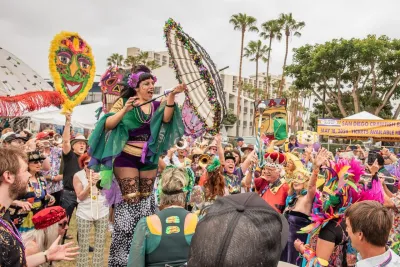 A parade performer in the middle of the Gator by the Bay performance in San Diego