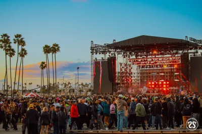 Concert goers looking at the stage during a CRSSD Festival with the San Diego Bay in the background