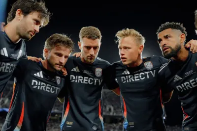 San Diego FC players gathered in a huddle at halftime of a game. 