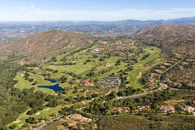 An aerial view of San Diego's Rancho Bernardo neighborhood, showing green expanses, roadways and houses.