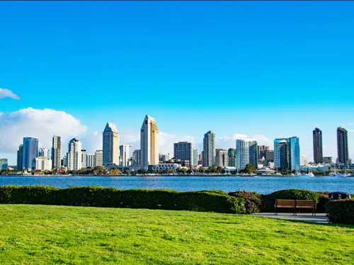 View of Downtown San Diego's skyline from the grassy Centennial Park in Coronado, CA