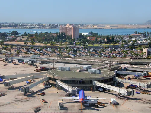 Aerial of a terminal at San Diego International Airport with the bay in the background