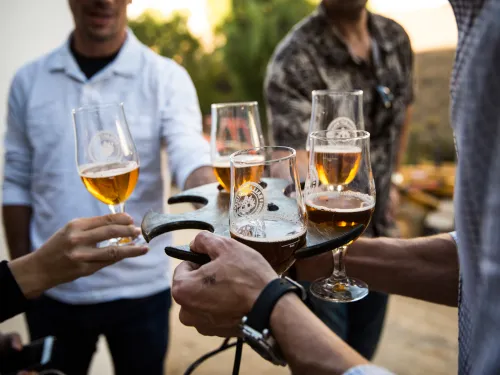 Group enjoying beer tasters at a local brewery in San Diego