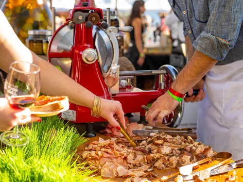 A chef serving food during the Del Mar Wine and Food Festival in San Diego, CA