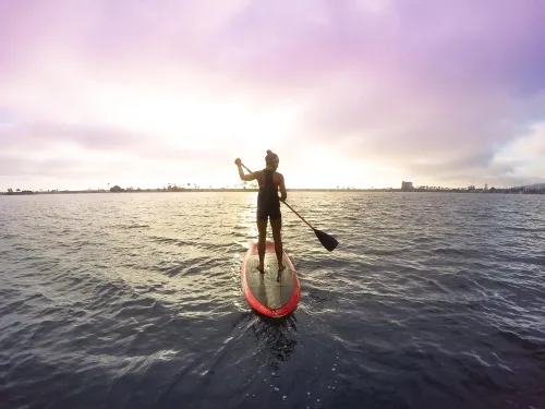 A woman on the paddle board in Mission Bay in San Diego