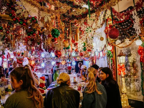 Group of people sitting at the bar during a Christmas Holiday Pop Up Bar in San Diego