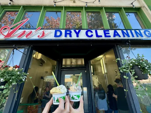 Two people cheers ice cream cups outside of An's Dry Cleaning in North Park of San Diego, CA
