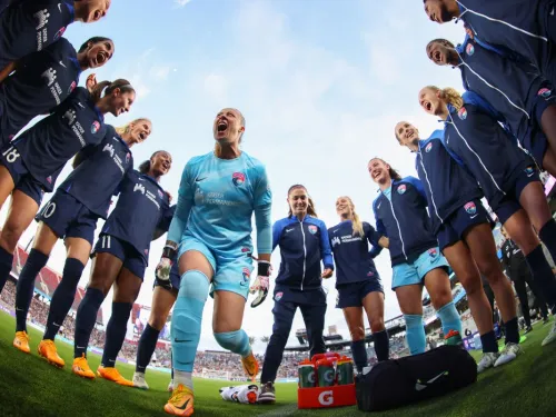 The San Diego Wave FC team gathered together on the field at Snapdragon Stadium