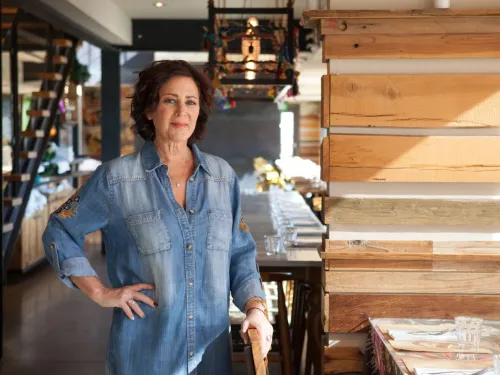 Tracy Borkum standing in front of her restaurant in San Diego, CA