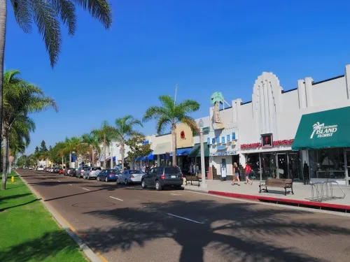 A view down Orange Avenue in Coronado, showing the area's charming shopping zone under a sunny blue San Diego sky 