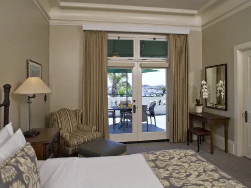 A view of a patio through an understated but elegant room at the Glorietta Bay Inn in Coronado near San Diego.